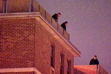 Police officers on rooftops